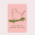 Card with a green cat on a skateboard and text 'On my way to destroy everything' on a pink background